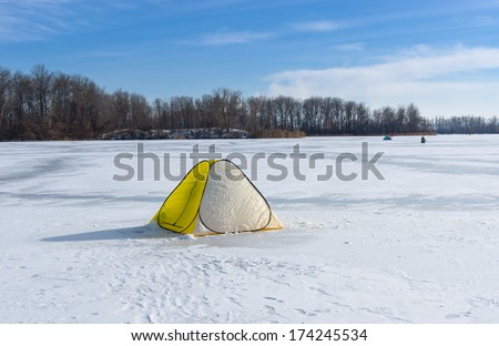 Tent of winter fisherman on a frozen river Dnepr in Dnepropetrovsk city, Ukraine