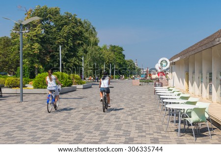 Dnepropetrovsk, Ukraine - August 15, 2015: People in the city cycling along Dnepr river embankment at summer season