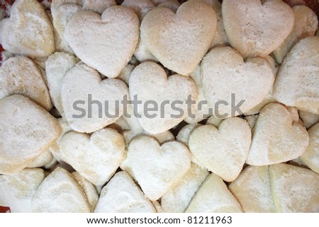 Cookies a heart kind are strewed by sugar powder