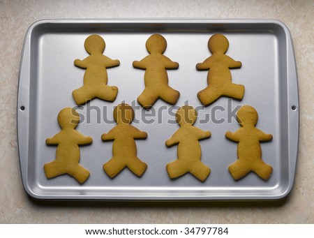 Gingerbread men on baking sheet