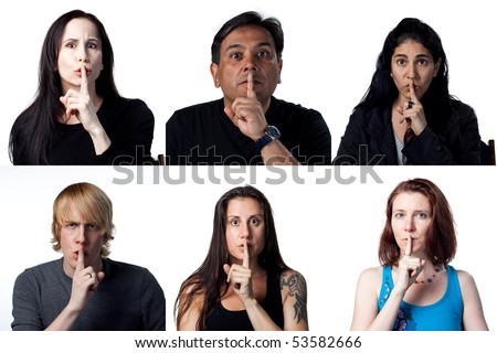 Group of people with fingers on their lips - quiet please