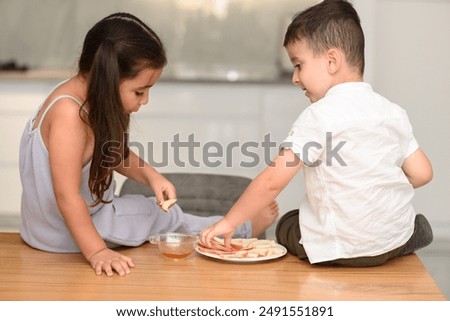 Similar – Image, Stock Photo Nibbling honey out of the jar with a spoon