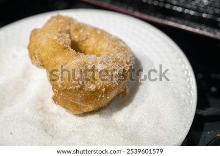 Similar – Image, Stock Photo Cooking doughnuts process. Homemade dough and deep-fried donuts, top view