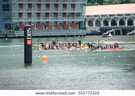 SINGAPORE - MAY 5: Unidentified teams participate in international dragon boat race at Marina Bay, Singapore on May 5, 2012. Close to 100 international dragon boat teams at the DBS Marina Regatta.