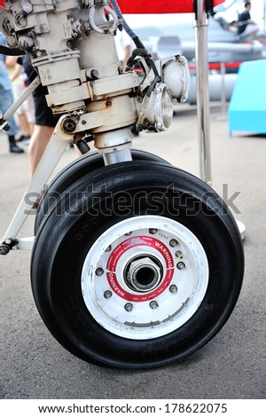 SINGAPORE - FEBRUARY 14: Airplane wheel on the ground at Singapore Airshow 2014, Asias Biggest For Aviations Finest at Changi Exhibition Centre on February 14, 2014 in Singapore.
