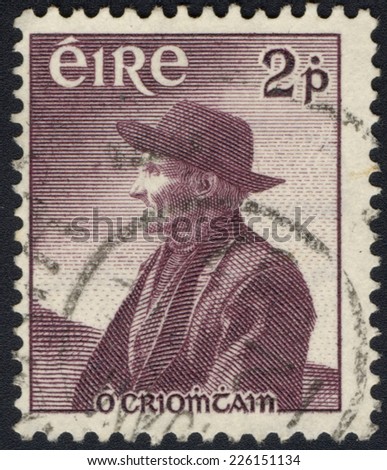 IRELAND - CIRCA 1956: A stamp printed in Republic of Ireland shows famous author Tomas OÃ¢Â?Â?Criomtain commemorating the anniversary of his death, circa 1956