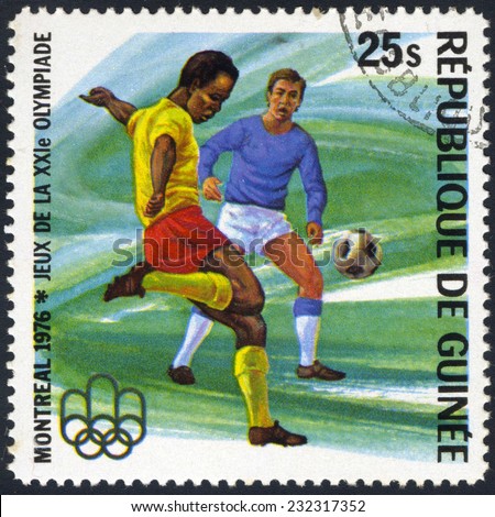 REPUBLIC OF GUINEA - CIRCA 1976: A stamp printed in Republic of Guinea shows football, series Montreal Olympics, circa 1976