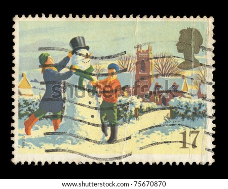 UNITED KINGDOM - CIRCA 1990: A stamp printed in the United Kingdom shows children making a snowman, circa 1990