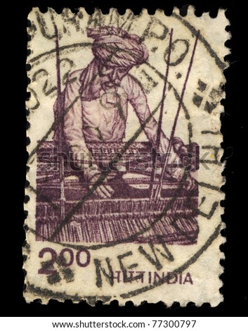 INDIA - CIRCA 1970: A stamp printed in India shows artisan the loom, circa 1970