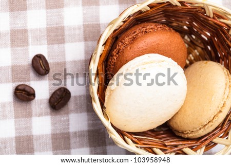 Three colors of macaroons in brown and beige tones