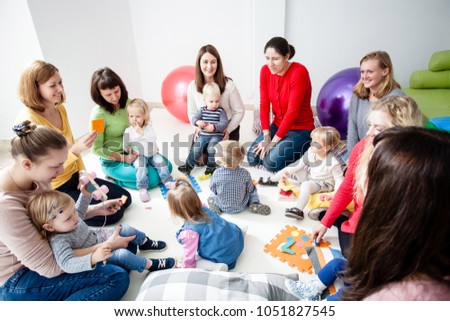 Similar – Image, Stock Photo Young mom playing with her baby in the sand