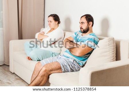 Similar – Image, Stock Photo Unemotional couple sitting on asphalt road in city