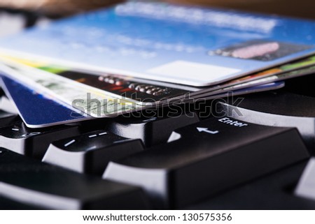 E-commerce, shopping on the internet, different credit cards on the keyboard