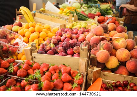 Various fresh fruits in boxes on the market