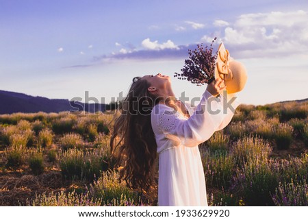 Similar – Image, Stock Photo Woman with lavender flowers near the purple minivan
