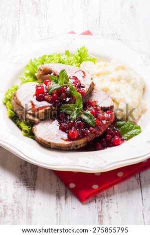 Beef with cranberry sauce and mashed potato
