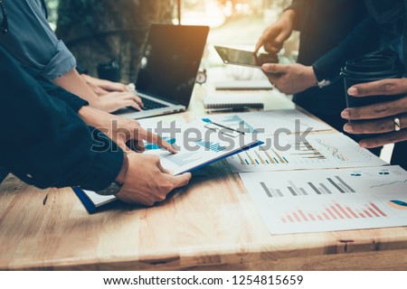 Teamwork with business people analysis cost graph on desk at meeting room. Stok fotoğraf © 