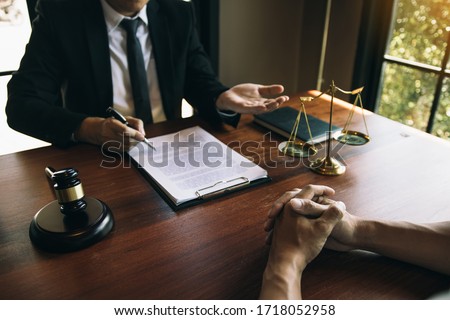 Client is explaining the offense to the lawyer and working together to solve the problem of the offense. Сток-фото © 