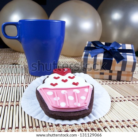 Sweet cup cake cookie, gift box, cup of coffee and balloons