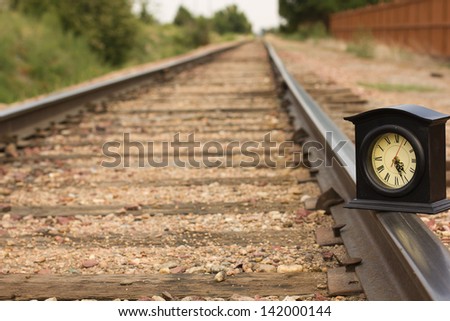 A clock on a railroad track getting the time right back on track