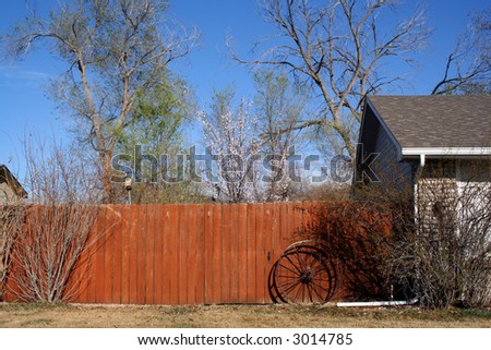 Spring time  in Grand Junction , Colorado . Fragment of house fence in sunny neighbourhood .
