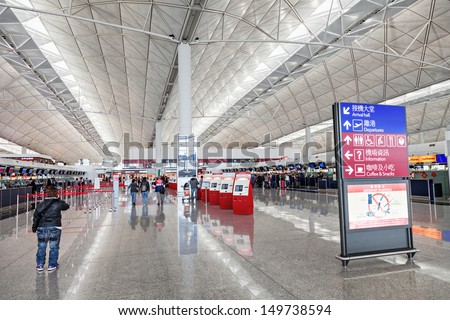HONG KONG, CHINA - FEBRUARY 21: Passengers in the airport main lobby of Hong Kong airport on February, 21, 2013 in Hong Kong, China. Hong Kong airport handles more than 55 million passengers per year