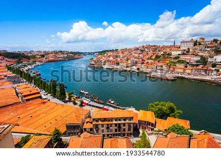 Douro river and local houses with orange roofs in Porto city aerial panoramic view. Porto is the second largest city in Portugal. Stock foto © 