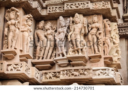 Stone carved erotic bas relief in Hindu temple in Khajuraho, India
