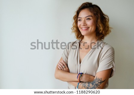 Similar – Image, Stock Photo Confident tattooed woman looking at camera