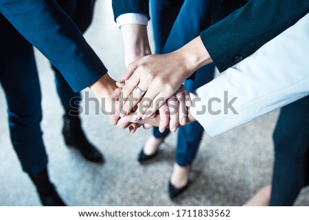 Cropped shot of women putting hands together in circle. Closeup shot of female hands. Teamwork concept