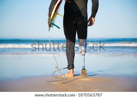 Similar – Image, Stock Photo Crop surfer on board in sea water