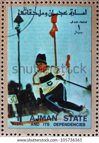 AJMAN - CIRCA 1973: a stamp printed in the Ajman shows Slalom, Alpine Skiing, Winter Olympics, circa 1973
