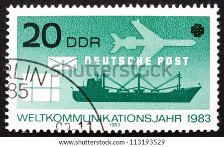 GDR - CIRCA 1983: a stamp printed in GDR shows Surface and Air Mail, World Communications Year, circa 1975