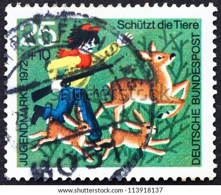 GERMANY - CIRCA 1972: a stamp printed in the Germany shows Hunter Chasing Deer and Rabbits, Animal Protection, circa 1972