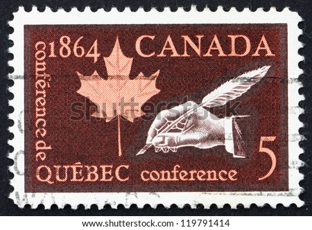 CANADA - CIRCA 1964: a stamp printed in the Canada shows Maple Leaf and Hand Holding Quill Pen, Centenary of Quebec Conference, Creation of the Canadian Nation, circa 1964