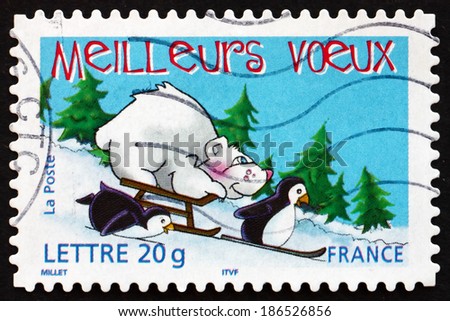 FRANCE - CIRCA 2005: a stamp printed in the France shows Two Penguins, Bear and Sled, Holiday Greetings, circa 2005