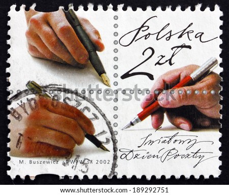 POLAND - CIRCA 2002: a stamp printed in the Poland shows Hand with Pen, World Post Day, circa 2002