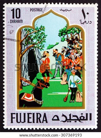 FUJEIRA - CIRCA 1967: a stamp printed in the Fujeira shows Scene from the Fairy Tale Ali Baba and the Forty Thieves, circa 1967