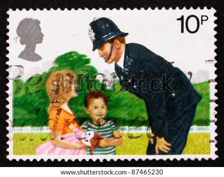 GREAT BRITAIN - CIRCA 1979: a stamp printed in the Great Britain shows Police Constable and Children, 150th anniversary of London Metropolitan Police, circa 1979