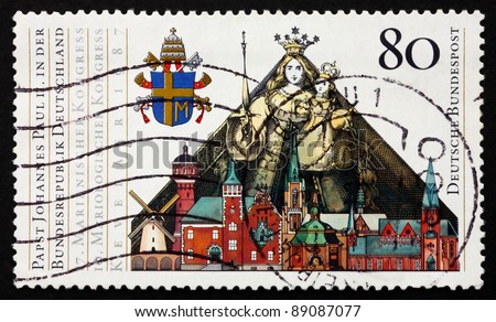 GERMANY - CIRCA 1987: A stamp printed in the Germany shows Papal Arms, Madonna and Child and Buildings in Kevelaer, State visit of Pope John Paul II, circa 1987