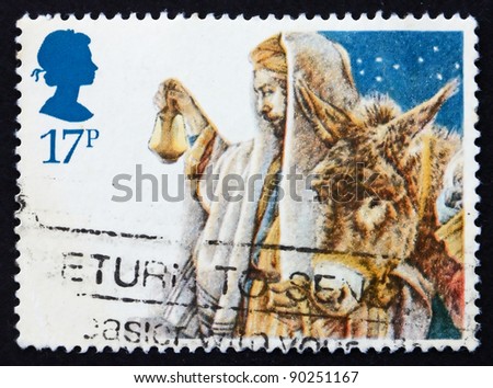 GREAT BRITAIN - CIRCA 1984: a stamp printed in the Great Britain shows Arrival of the Holy Family in Bethlehem, crayon sketch by Yvonne Gilbert for Christmas, circa 1984