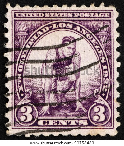UNITED STATES OF AMERICA - CIRCA 1932: A stamp printed in the United States of America shows Runner at starting mark, circa 1932