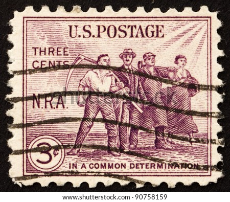UNITED STATES OF AMERICA - CIRCA 1933: A stamp printed in the United States of America shows Group of workers, issued to arouse support for the NRA (National Recovery Administration), circa 1933
