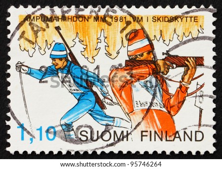 FINLAND - CIRCA 1980: a stamp printed in the Finland shows Biathlon, Winter Sport, cross-county skiing and rifle shooting, circa 1980