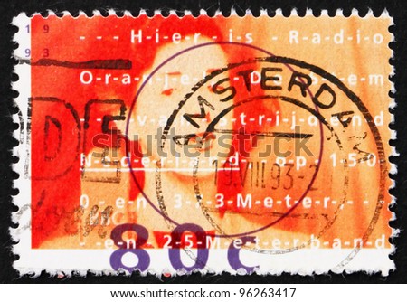 NETHERLANDS - CIRCA 1993: a stamp printed in the Netherlands shows Woman Broadcasting, Radio Orange, circa 1993
