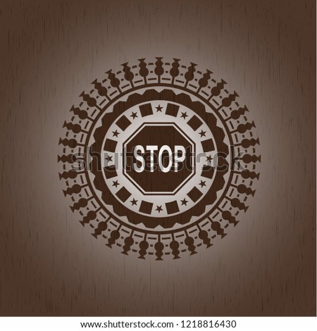 stop icon inside badge with wood background