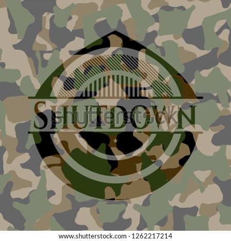 Shutdown written on a camouflage texture