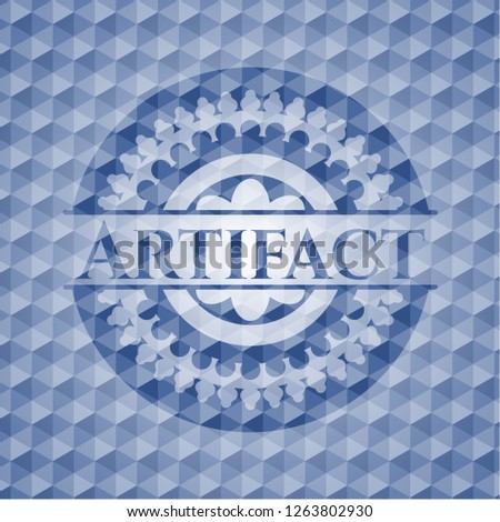 Artifact blue emblem or badge with abstract geometric pattern background.
