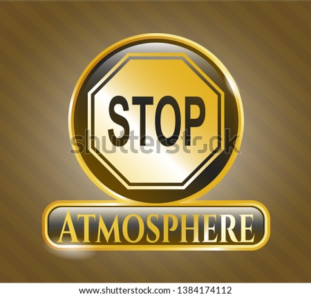  Gold emblem or badge with stop icon and Atmosphere text inside