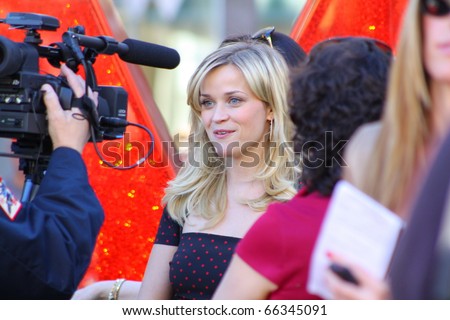 HOLLYWOOD - DECEMBER 1: Actress Reese Witherspoon giving interviews after  receiving her star on the Hollywood Walk of Fame December 1, 2010 in Hollywood, CA.